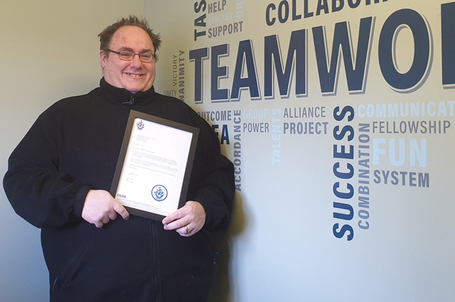 Simon Crisp of Green Machine with his Blue Peter badge