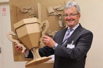 David Pedley with a cardboard trophy, created to celebrate GWP’s 25 years in business