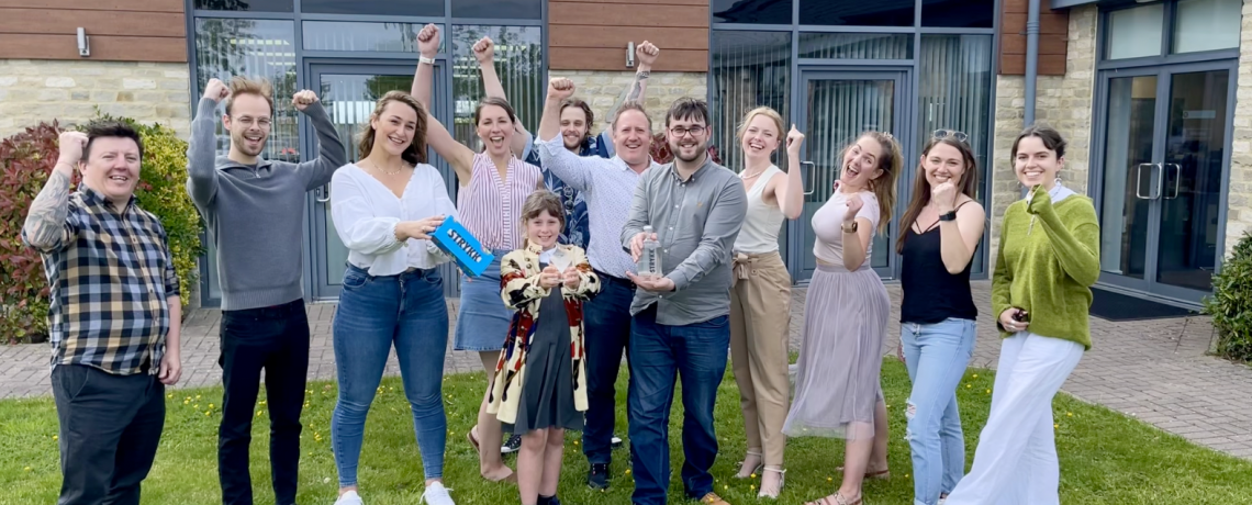 Pictured the Infinity Nation team with their trophy (held by company mascot and CEO's daughter Marnie, aged 10) and Strykk produce