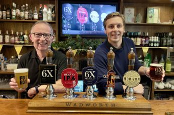 Head brewer Andy Weaver with Evolution Trial 1 and Toby Bartholmew with a pint of 6X 100th anniversary edition
