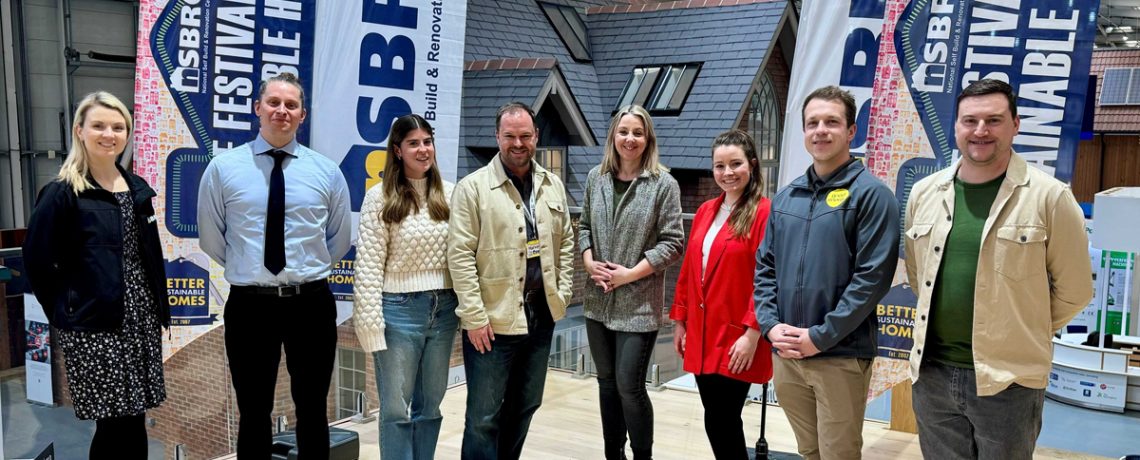 Harvey Fremlin and Laura Wildish (centre) with their colleagues at the National Self Build and Renovation Centre in Swindon