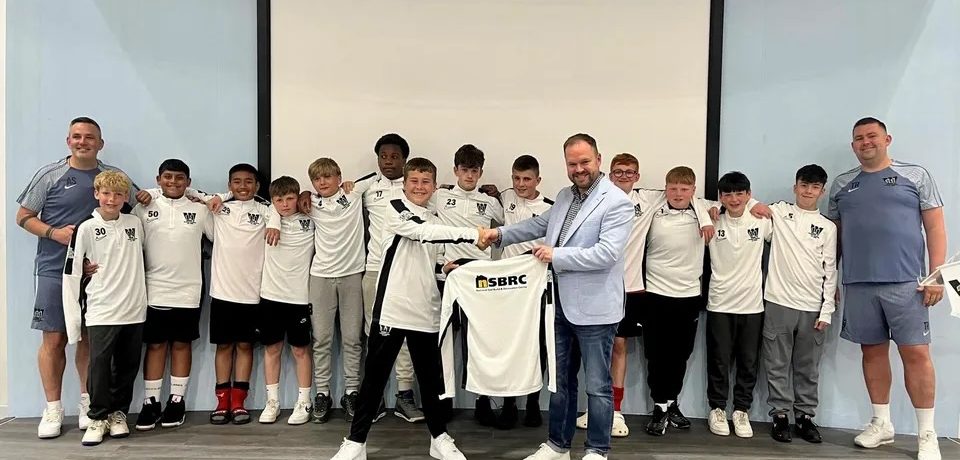 Swindon's National Self Build & Renovation Centre presented young footballers with branded team kit in time for a major tournament.