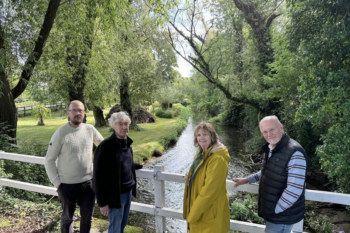 Pictured: Broad Chalke Community Land Trust chairman Dan Richter, left, board member Ian Walkden and treasurer Tom Hitchings with White Horse Housing Association Operations Director Belinda Eastland at the River Ebble in the village
