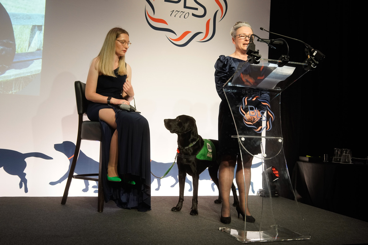 Members of Bristol Law Society have raised £12,000 for their charity of the year, Dogs for Good.