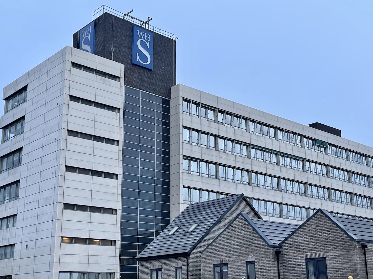 WH Smith has suspended its dividend and warned of weaker profits, as geopolitical disruption and slowing passenger spending weigh on the travel retail sector.