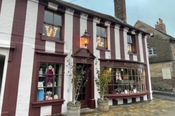 A retailer has been told the striking stripes she painted on the front of her historic shop must go.